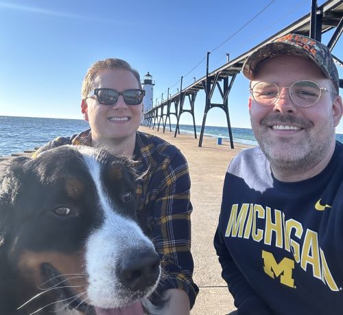 Robert Humble with husband Anthony and dog Rooster at a Michigan lighthouse.